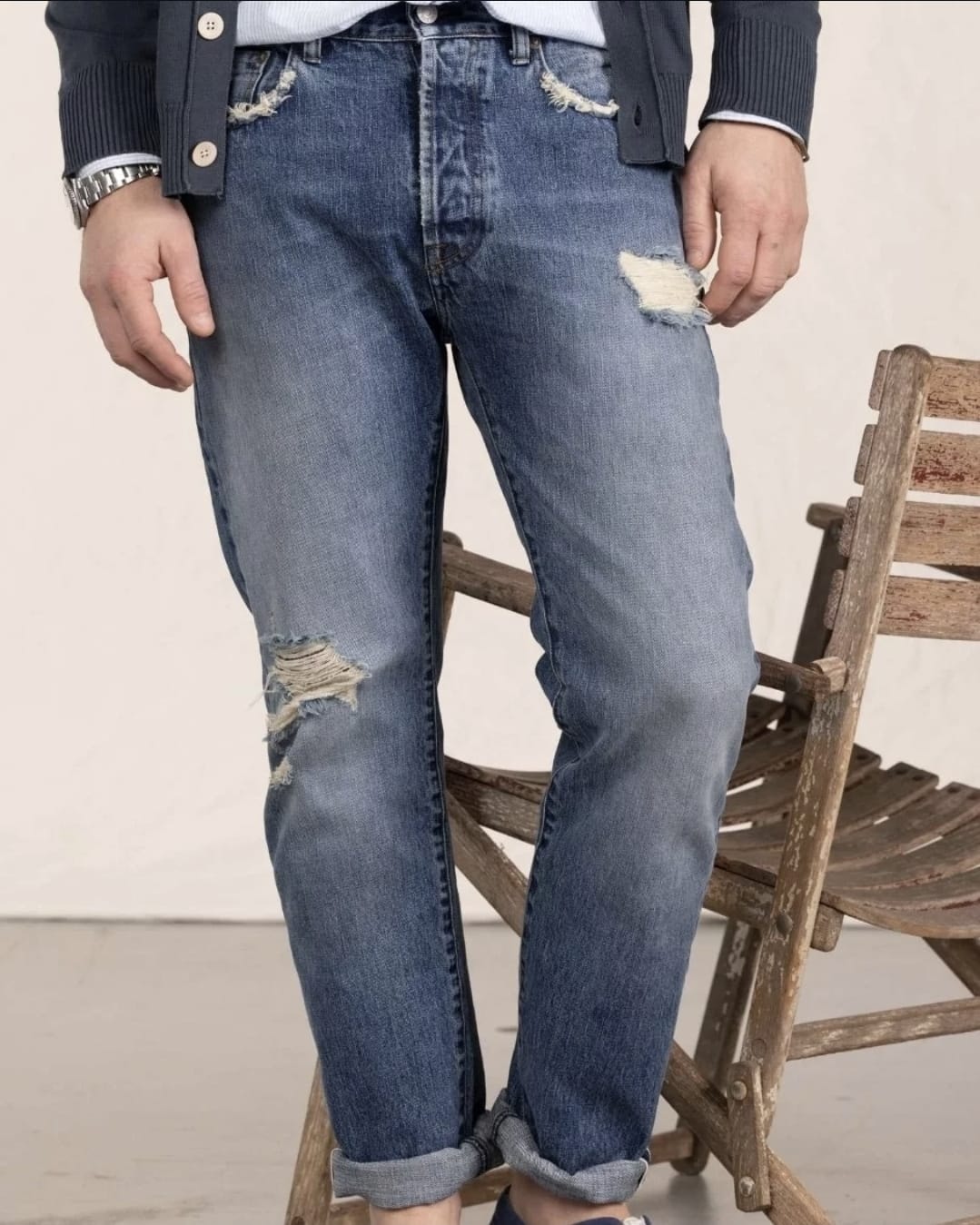 Distressed denim jeans with cardigan